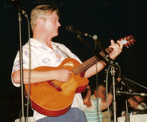 Randy Boone entertains at the pool party.