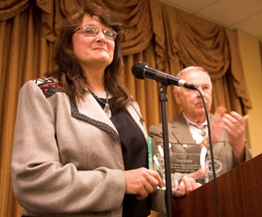 A special award was given at the banquet by Ray Nielsen and Boyd Magers to a selfless Carol Ann Kellum who creatively decorated Whispering Woods with all sorts of western memorabilia to accent the weekend.