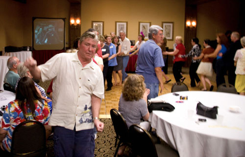 Randy Boone leads the “train” doing “The Locomotion”.