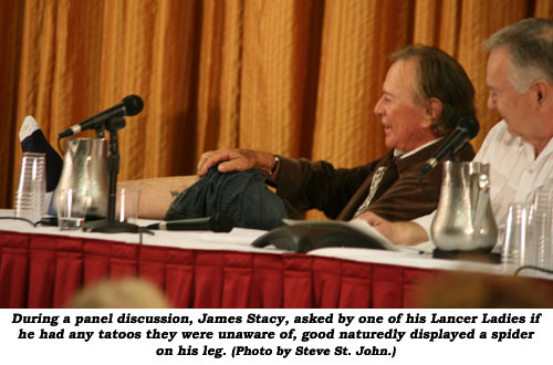 During a panel discussion, James Stacy, asked by one of his Lancer Ladies if he had any tatoos they were unaware of, good naturedly displayed a spider on his leg. (Photo by Steve St. John.)