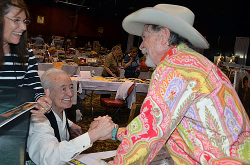 Henry Darrow and wife Lauren greet Buck Taylor.