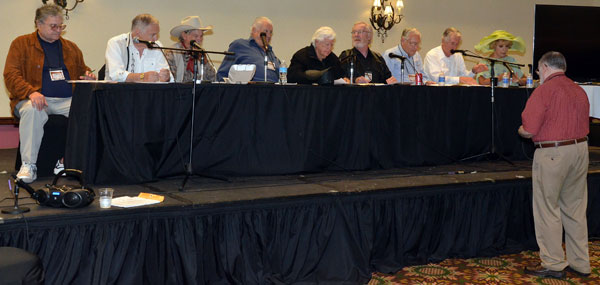 Rehearsing for the “Gunsmoke” radio show re-creation, (L-R) Dennis Devine, Boyd Magers, Buck Taylor as Doc, Robert Colbert, badmen Clu Gulager and Michael McGreevey, John Buttram, Robert Fuller as Matt Dillon and Ruta Lee as Miss Kitty. Gary Yoggy was the director.