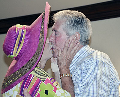 Ruta Lee and Robert Fuller kiss. Just as they did on a “Wagon Train” episode.