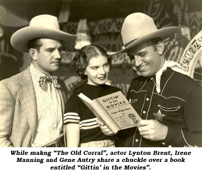 While making "The Old Corral", director Joe Kane, Irene Manning and Gene Autry share a chuckle over a book entitled "Gittin' in the Movies".