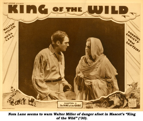 Nora Lane seems to warn Walter Miller of danger afoot in Mascot's "King of the Wild" ('30).