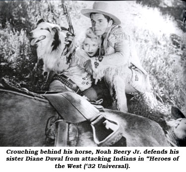 Crouching behind his horse, Noah Beery Jr. defends his sister Diane Duval from attacking Indians in "Heroes of the West" ('32 Universal).