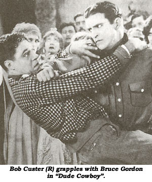 Bob Custer (R) grapples with Bruce Gordon in "Dude Cowboy".