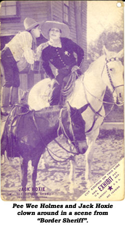 Pee Wee Holmes and Jack Hoxie clown around in a scene from "Border Sheriff".