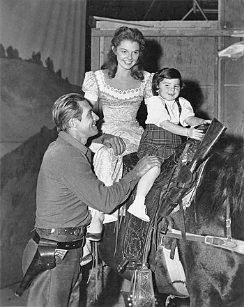 Jock Mahoney with co-star Luana Patten and her sister Marcy on Jock’s horse on the set of “Joe Dakota” (‘57 U-I). (Photo courtesy Roy Bonario.) 