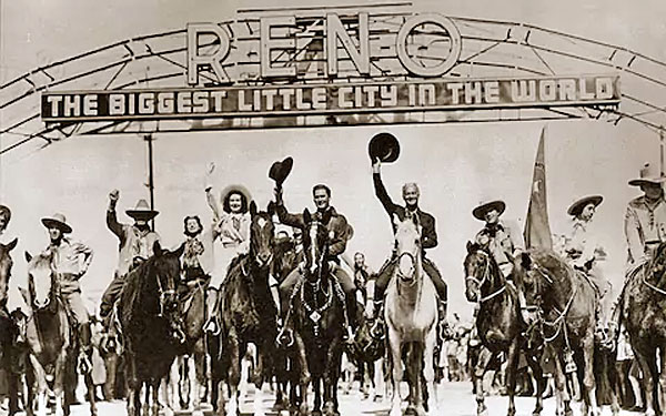 In 1940 Warner Bros. sent an 18 car train with 225 stars and newspapermen to both Virginia City and Reno, NV for the premiere of “Virginia City” starring Errol Flynn. Flynn and William Boyd as Hopalong Cassidy wave their hats in the center. Buck Jones is on the far right. 