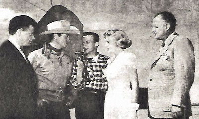 Tim Holt is greeted after landing in Casper, WY in 1950 for a personal appearance by (L-R) Mayor Robert Rose, Ed Peiss of radio station KVOC, Jacqueline White and Russell Schulte, executive vice president of Rialto Theater Inc. Jacqueline was now Mrs. Bruce Anderson and living in Casper. 