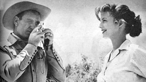 “Annie Oakley”, “Gene Autry Show”—Gail Davis smiles sweetly for Gene Autry’s 
Instamatic camera. 