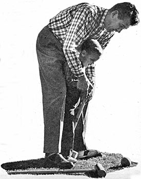 Jeffrey, age 3, gets some expert instruction in the gentle art of croquet from his Dad, Robert Rockwell aka “The Man From Blackhawk”. 