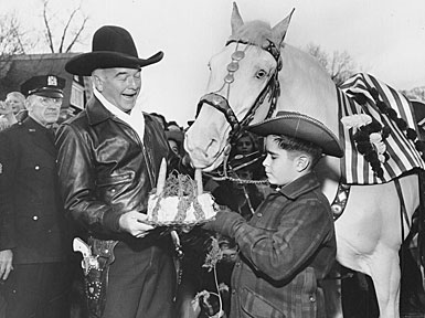 A young fan brings Hopalong’s Topper a carrot cake birthday cake. 