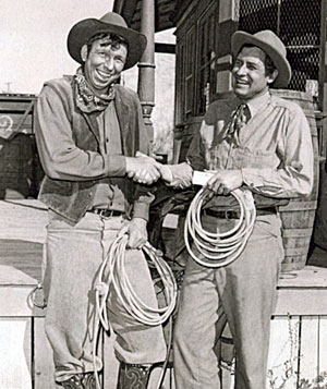 Slim Pickens hands an award to Will Rogers Jr. making him an honorary member of the Rodeo Cowboys Association in 1952. 