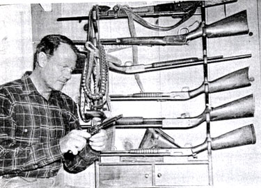 Joel McCrea and his impressive gun collection.