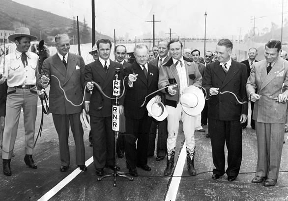 Dedication in 1940 of the Cahuenga Pass Freeway. (L-R) Tom Keene, honorary Mayor of Sherman Oaks; Gov. Colbert Olson; John B. Kingsley, President of the Hollywood Chamber of Commerce; L. A. Mayor Fletcher Bowron; Gene Autry, honorary Mayor of North Hollywood; Burbank Mayor Frank C. Tillson; and Richard Arlen, honorary Mayor of Sunland. (Thanx to Bobby Copeland.)