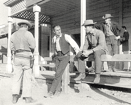 Kelo Henderson (sittling on railing), star of TV's “26 Men”, was the gun coach to Stewart Granger in “Gun Glory”.