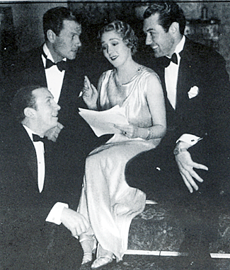 Paying great attention to Mary Pickford are Fuzzy Knight, Joel McCrea and Johnny Mack Brown. 