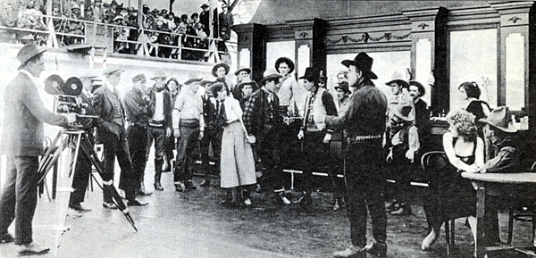 Even in 1917 Universal Studios knew how to make a few extra bucks by admitting tourists (top left) to its lot in the Cahuenga Pass area. Here they are viewing the filming of a Harry Carey Sr. silent Western. 