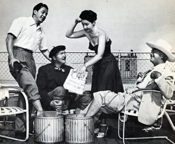 Kirk Alyn, Albert Dekker, Virginia O’Brien and Hopalong Cassidy relax on the roof of the Ambassador East hotel in Chicago. 