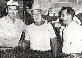 Allan "Rocky" Lane paid Alabama head coach Harold "Red" Drew a visit at a practice game as the Crimson Tide prepared for Tennessee. Johnny Dee, former Notre Dame athlete and Bama's basketball coach is on the right. 