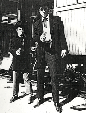 Stuntman Bill Catching with Kelo Henderson's son Lars filming one of the Fanner 50 capgun commercials together in 1956 or '57.