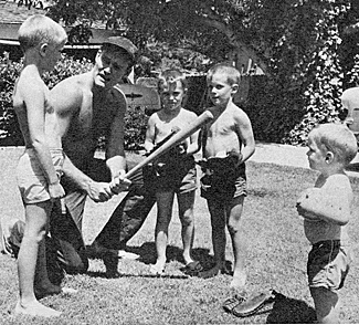 "The Rifleman", Chuck Connors has a baseball diamond in his backyard and gets his kids started young. 