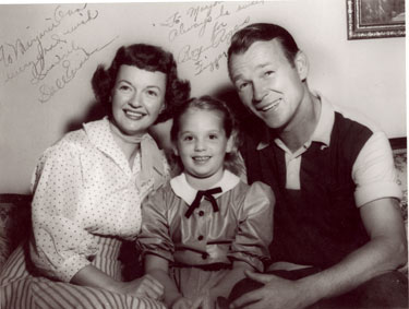 Roy and Dale with Marjorie Bingham-Bowron. Notice that this photo was obviously taken at the same time as the one above (Roy and Dale’s clothing and picture on the wall).