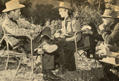 Alan Ladd, Mona Freeman and director Rudy Mate take a break between filming scenes of “Branded” in Salt River Canyon, Arizona.