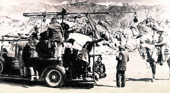 Roy Rogers and Trigger make ready for another scene at Lone Pine, CA, for “Under Western Stars”, Roy’s first Republic western in 1938. (Thanx to Jerry Whittington.)