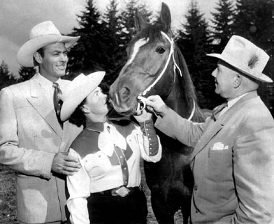 Allan “Rocky” Lane at a racetrack with his mare that had won several races. Alan Young of “Mr. Ed” said, “Everytime Allan got cantankerous with me I would change the conversation and start talking about his racehorse. The little mare had won several races and Allan was always anxious to talk about her.” (Thanx to Bobby Copeland.)