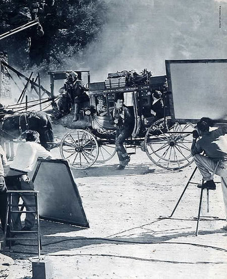 John Wayne, Claire Trevor and others during the filming of “Stagecoach”. (Thanx to Bobby Copeland.)