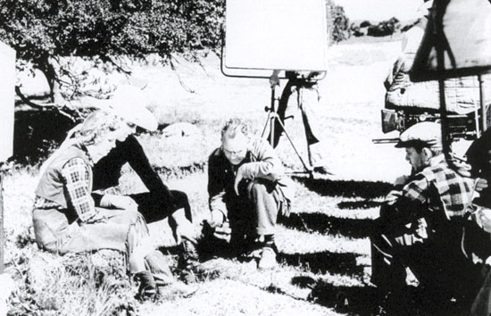 Director Sam Nelson (center) goes over a scene for Columbia’s “South of Arizona” (‘38) with Iris Meredith and Charles Starrett.