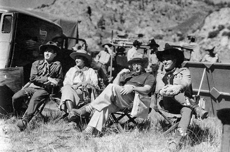 (L-R) George E. Stone, Sheila Mannors, director D. Ross Lederman and Dick Foran on location for “Moonlight on the Prairie”.