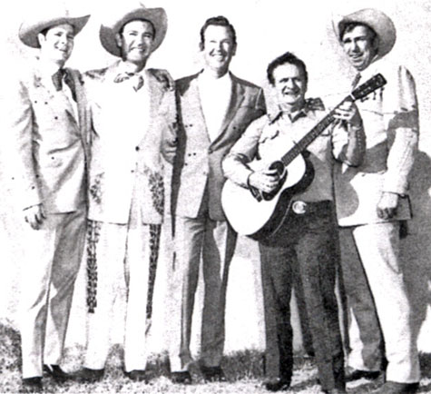 Western wear tailor Nudie with (L-R) Casey Tibbs, Tex Williams, Rex Allen and Slim Pickens.