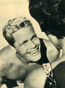 Trampas of “The Virginian”, Doug McClure, emerges from the swimming pool to greet a fan.