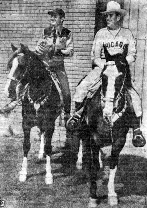 Baseball fan Gene Autry (left) changes hats with Chicago Cubs’ star Dizzy Dean at the Cubs training grounds in L.A. (year unknown)