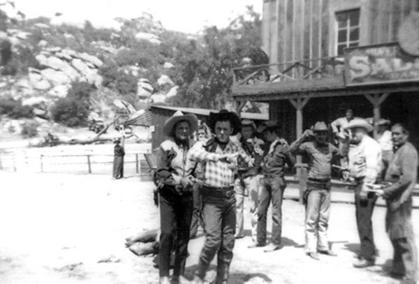 Ray “Crash” Corrigan puts a gun on a badman during one of his Corriganville shows. Circa 1955. Chief Thunder Cloud and Max Terhune are on the far right. (Thanx to Vince Guerriero.)