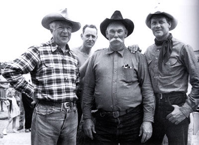 Producer Harry “Pop” Sherman, unknown, unknown and Joel McCrea on the set of “Four Faces West” in 1948.