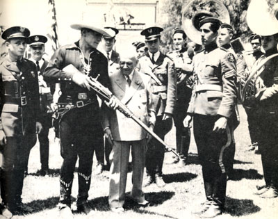 Buck Jones with Universal’s Carl Laemmle in 1935 at Universal City entertaining boys from east L.A. composing the Buck Jones Rangers Band.