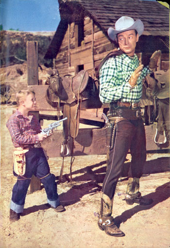 Six year old Deever Jenkins holds Roy Rogers at bay for a 1955 TV GUIDE photo shoot.