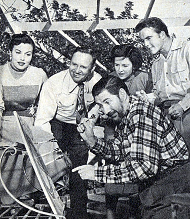 A comical game of darts during a barbeque at Gene Autry’s home in 1952 with Pat Buttram and his wife Sheila Ryan (left) and Betty and Dick Jones.