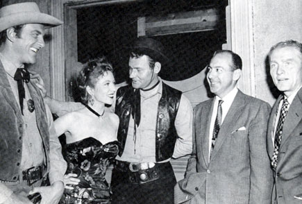 On the set for “Gunsmoke: Hack Prine”, the first episode filmed, are (L-R) James Arness, Amanda Blake, Leo Gordon, Harry Ackerman (VP in charge of CBS West Coast progamming) and Hal Hudson (CBS program advisor).