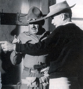 Director Sam Peckinpah gives some direction to William Holden during the making 
of “The Wild Bunch” (‘69 WB). 