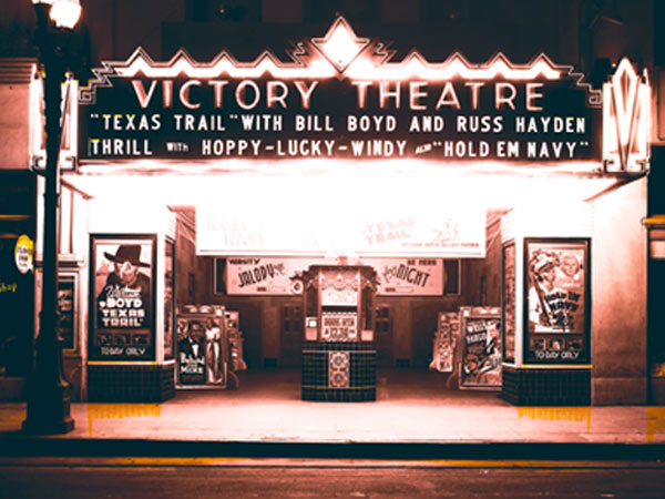 Nostalgia! Here's the way we used to enjoy going to the movies. Two shots of the Victory Theatre (anybody know in what town this theatre might have been?) in 1941 showing a double feature of Hoppy's "Texas Trail" (in re-release) and "Hold 'Em Navy" with Abbott and Costello. Notice the poster to the right of the boxoffice shows "Wells Fargo" with Joel McCrea as coming soon.